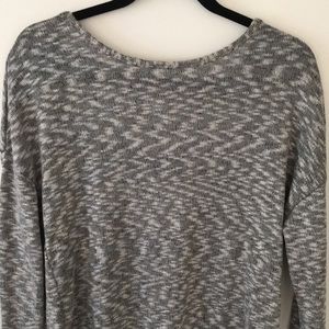 Brand new grey sweater with cut out back.